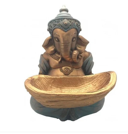 Serene Ganesha with golden offering bowl
